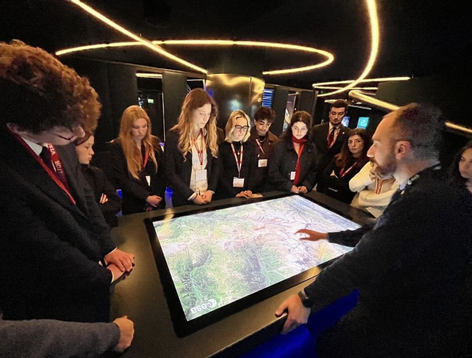 Students around interactive table